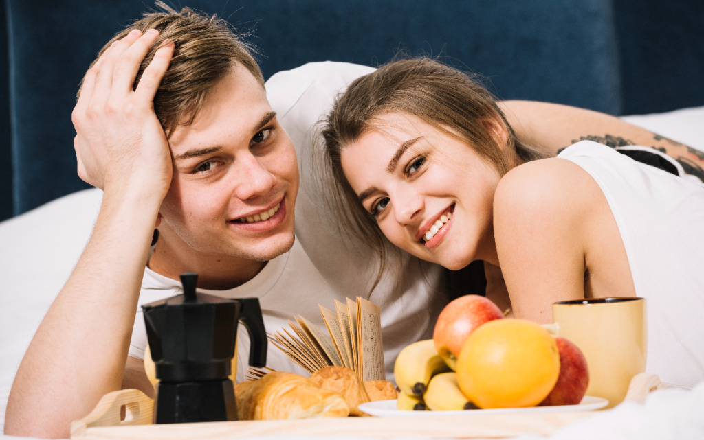 happy-couple-lying-bed-with-tray-food (1).jpg