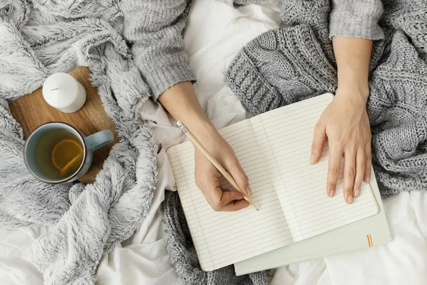 close-up-woman-writing-notebook.jpg