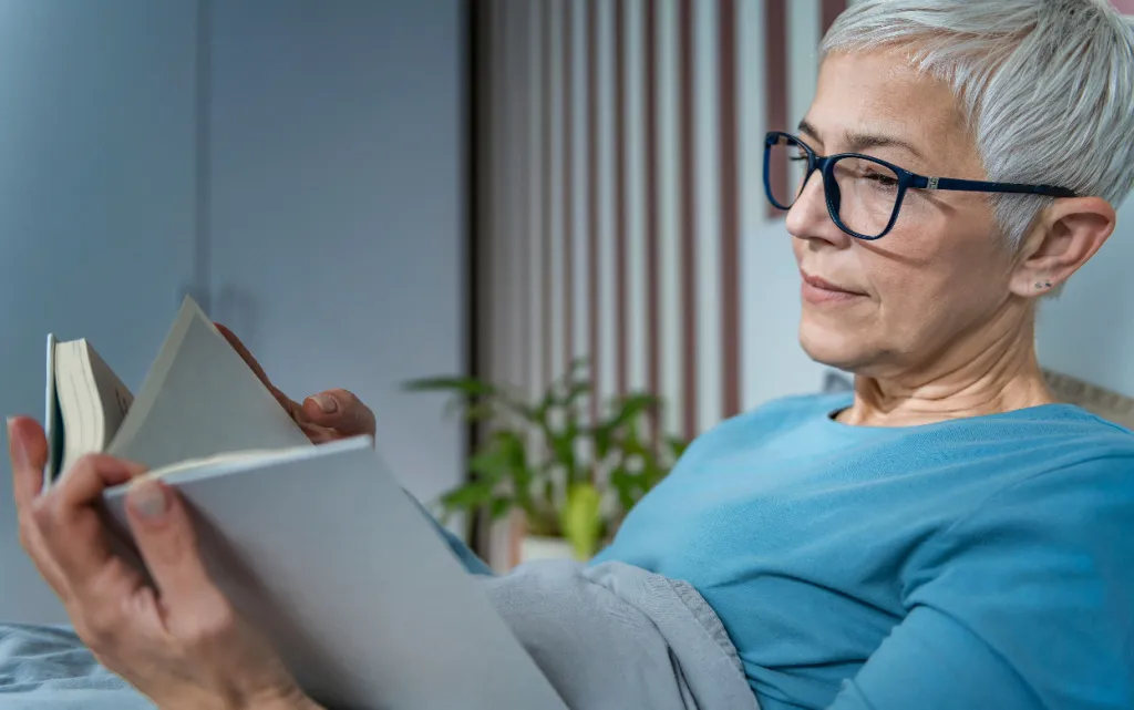 senior-woman-enjoying-a-book-while-resting-indoors-2026-09-24-04-57-30-utc (1).jpg