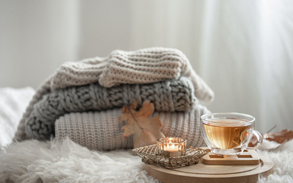 homemade-still-life-with-knitted-sweaters-cup-tea-blurred-background (1) (1).jpg
