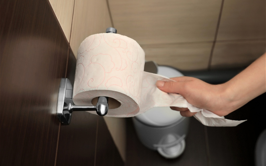 hand-pulling-embossed-toilet-paper-in-home-bathroo-2026-03-27-03-01-58-utc (1).jpg