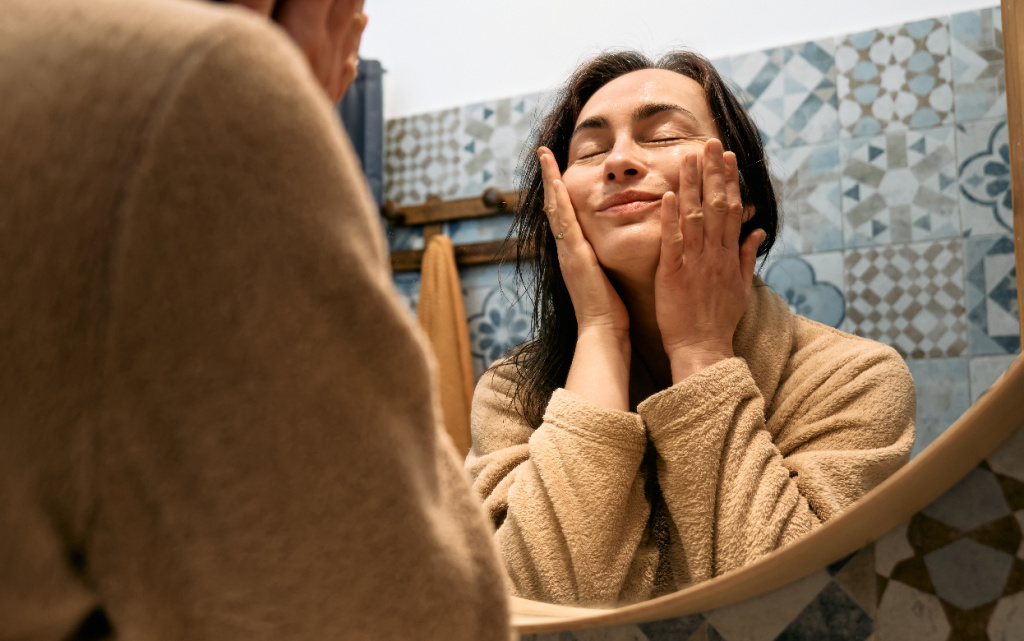 woman-looking-at-mirror-in-bathroom-and-touching-h-2026-01-08-06-29-46-utc (1).jpg