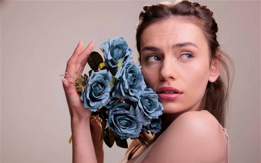 woman-posing-with-bouquet-of-blue-roses-2026-09-23-17-29-20-utc (1).jpg
