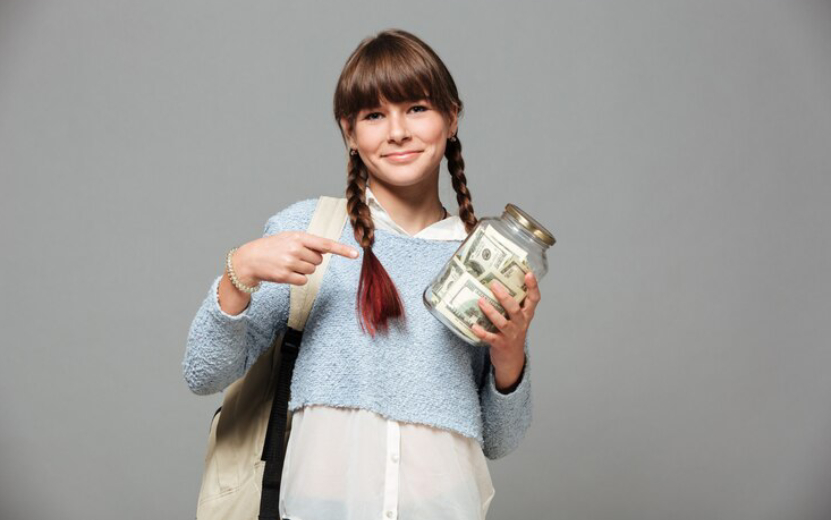 girl-standing-with-jar-full-money_171337-4705.jpg