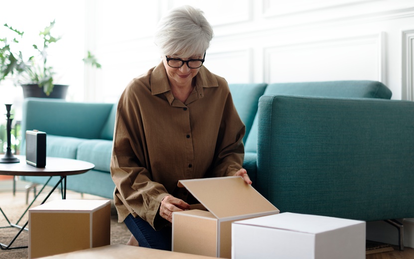 woman-unpacking-brown-boxes-living-room (1).jpg