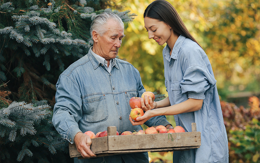 old-senior-standing-summer-garden-with-harvest.jpg