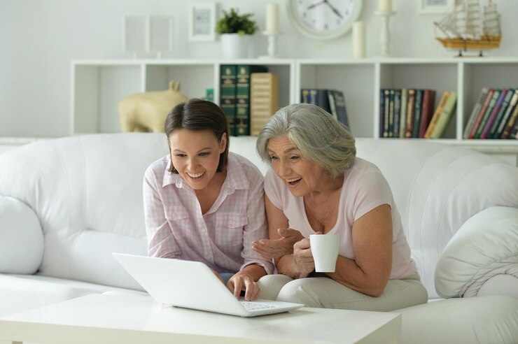 mother-daughter-sitting-table-with-laptop-home_484921-79106.jpg