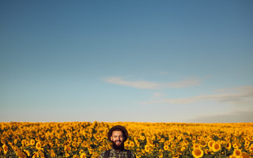 happy-man-in-sunflower-field-2023-11-27-05-14-18-utc.jpg