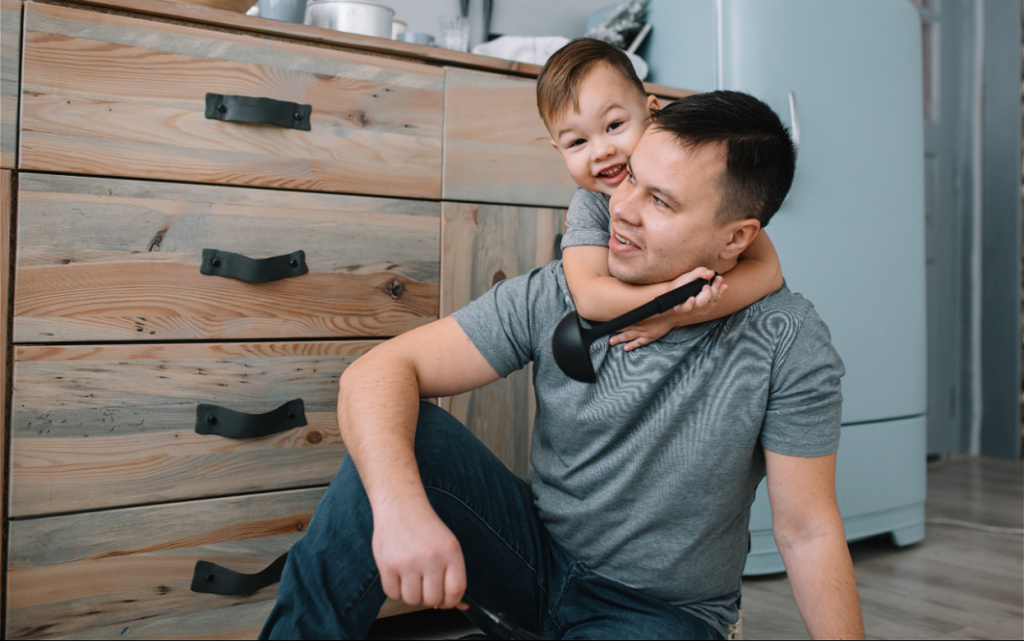 happy-boy-embraces-father-in-cozy-kitchen-2026-03-20-03-20-59-utc (1).jpg