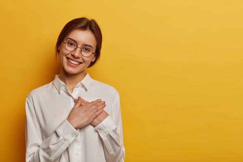 charming-positive-european-woman-presses-hands-chest-expresses-gratitude-gift-appreciates-help-wears-round-glasses-white-shirt.jpg charming-positive-european-woman-presses-hands-chest-expresses-gratitude-gift-appreciates-help-wears-round-glasses-white-shirt.jpg