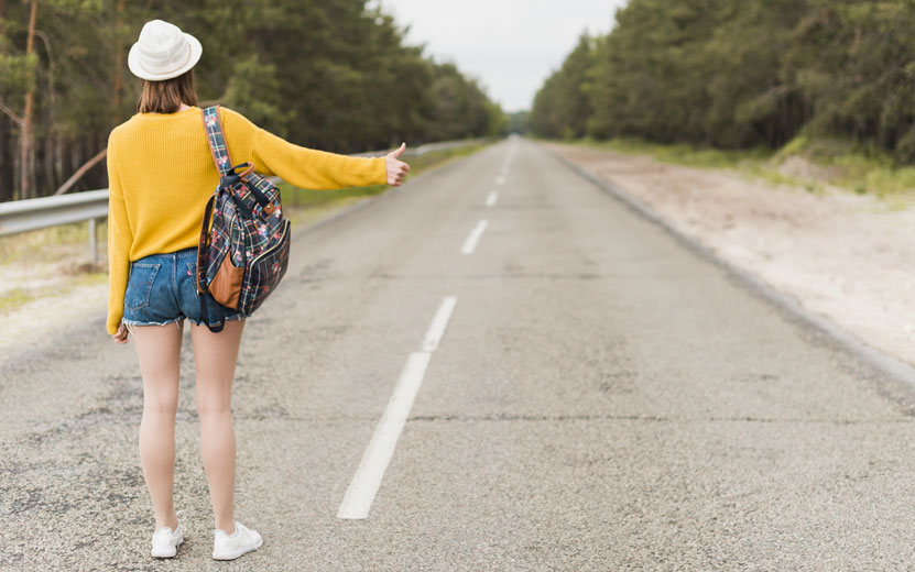 long-shot-woman-hitchhiking.jpg