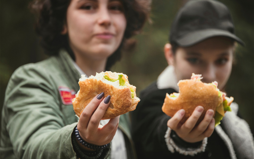 teens-enjoying-sandwiches-outdoors-in-a-natural-se-2026-03-17-08-39-57-utc (1).jpg