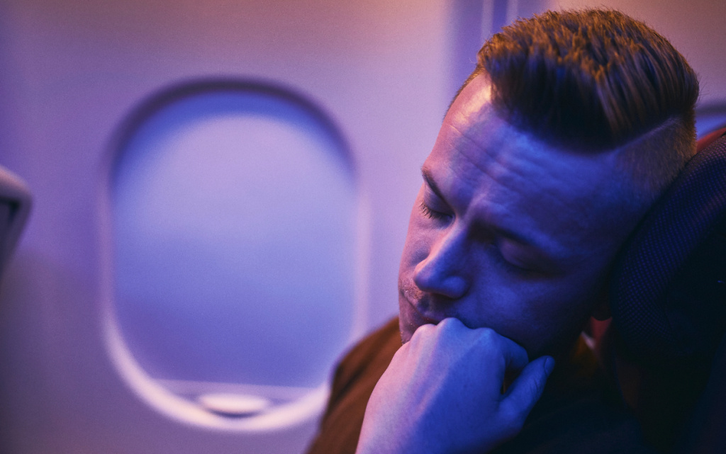 travel-by-airplane-tired-passenger-sleeping-durin-2026-01-08-01-41-28-utc (1).jpg