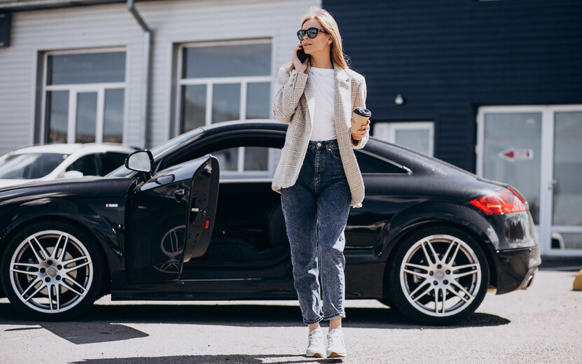 result_young-happy-woman-drinking-coffee-by-car.jpg