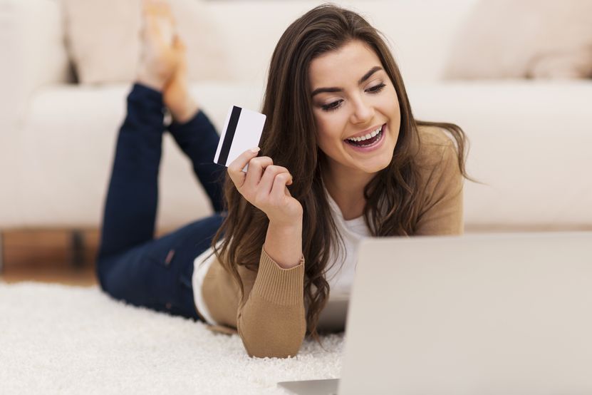 smiling-female-paying-shopping-by-credit-card.jpg