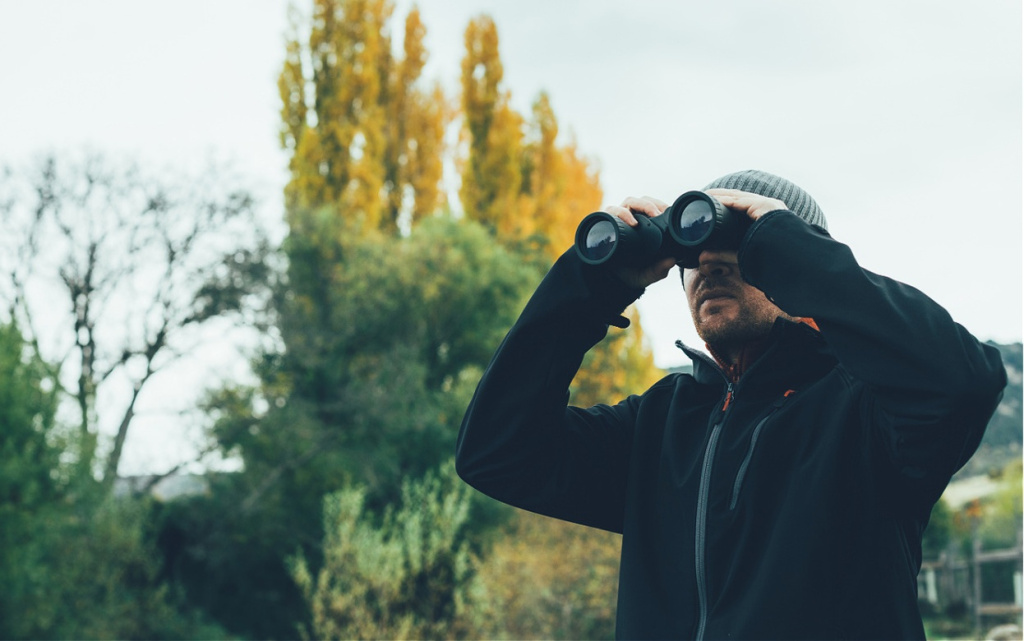 a-young-man-with-binoculars-in-te-mountain-2026-03-25-05-09-56-utc (1).jpg