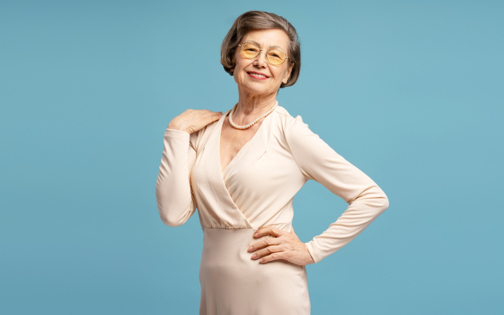 stylish-senior-woman-poses-on-blue-background-2026-03-24-07-42-35-utc (1).jpg