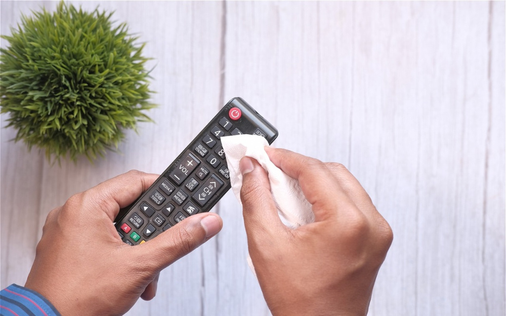 cleaning-remote-control-on-white-wooden-table-2026-01-06-10-25-00-utc (1).jpg
