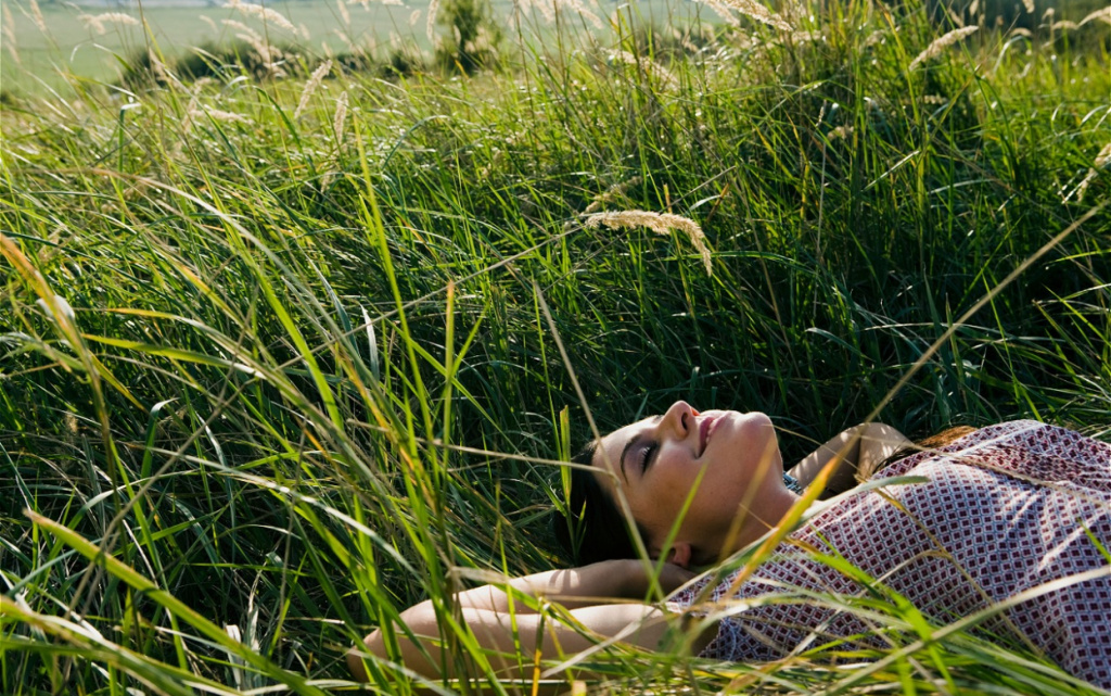 woman-relaxing-in-tall-grass-on-summer-day-2026-03-10-04-03-25-utc (1).jpg