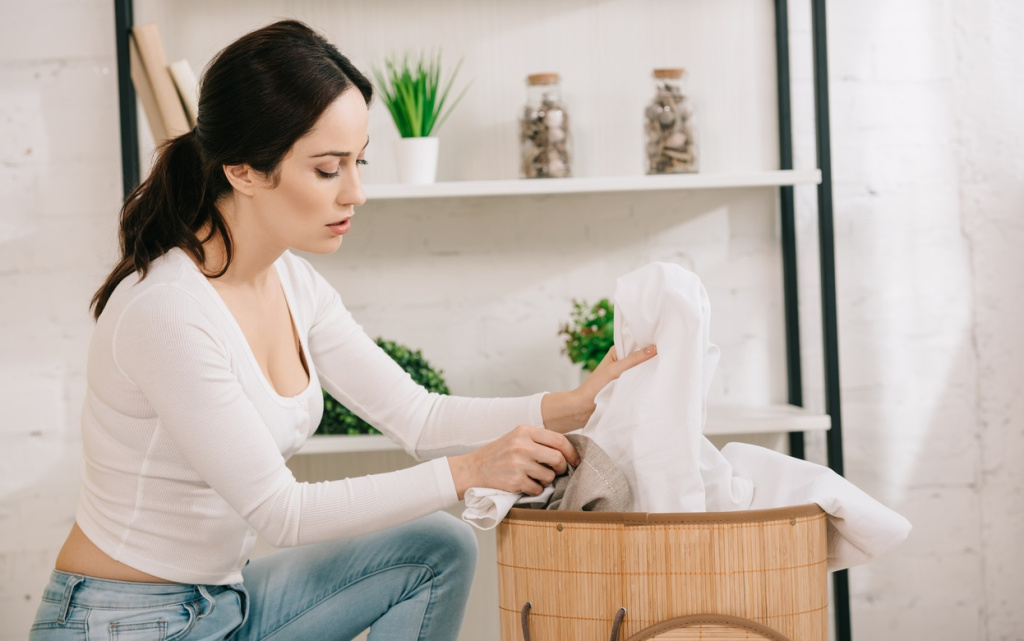 woman-sorting-laundry-in-a-bright-home-2026-03-13-01-21-37-utc (1).jpg