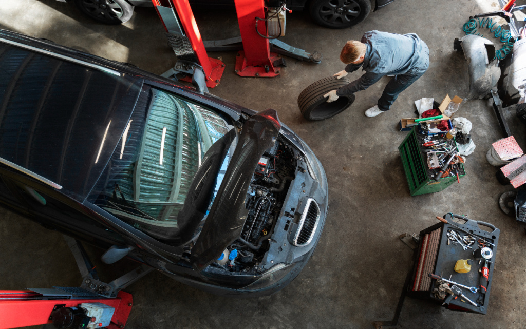 top-view-man-repairing-car (1).jpg