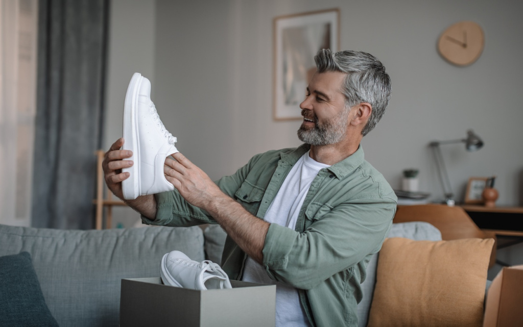 man-holding-new-white-shoes-at-home-2026-03-24-02-19-57-utc (1).jpg