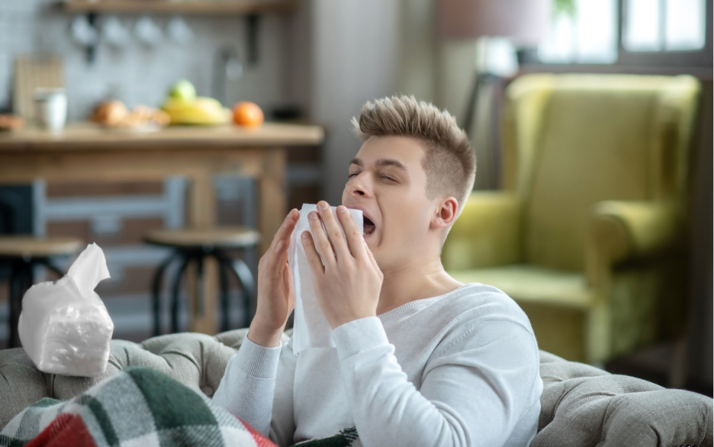 fair-haired-young-man-holding-a-napkin-and-sneezin-2026-03-10-01-05-31-utc (1).jpg