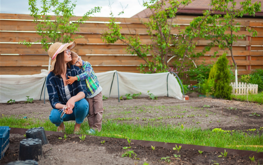child-and-mother-gardening-in-vegetable-garden-in-2026-03-09-08-59-09-utc (1).jpg
