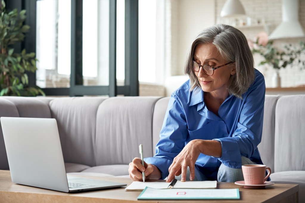 stylish-mature-older-woman-working-from-home-on-la-2023-11-27-04-58-23-utc.jpg