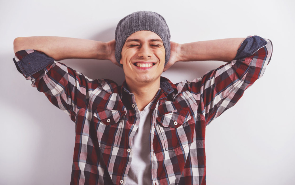 smiling-man-relaxing-indoor.jpg