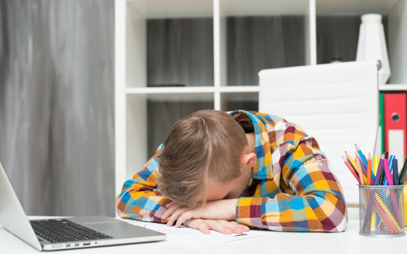 boy-sleeping-front-laptop-desk_23-2148018965.jpg