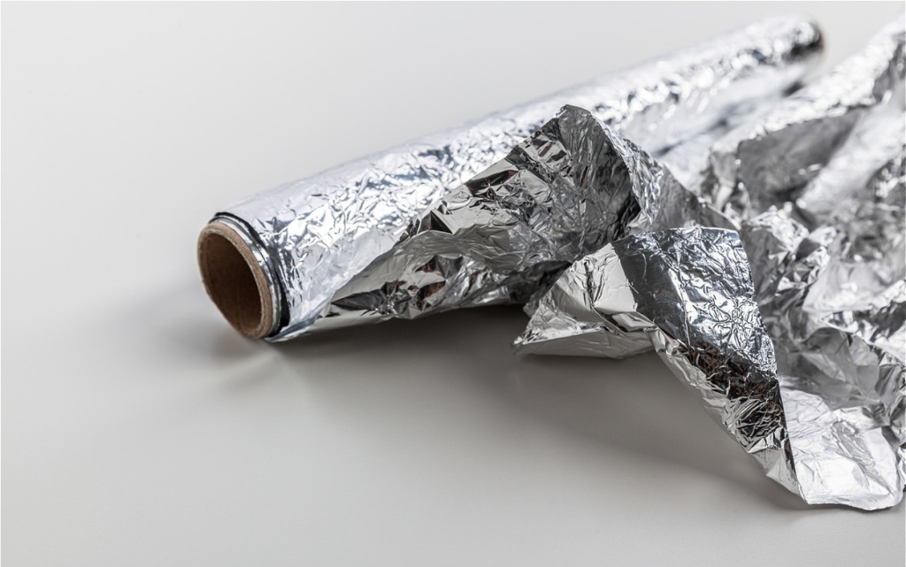 crumpled-aluminum-foil-roll-on-a-plain-white-surfa-2026-07-16-18-53-44-utc (1).jpg