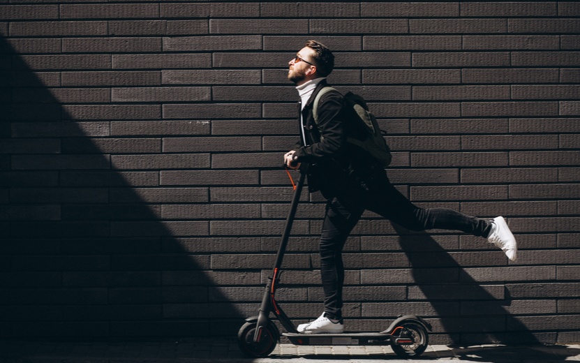 handsome-man-riding-town-scooter (1).jpg
