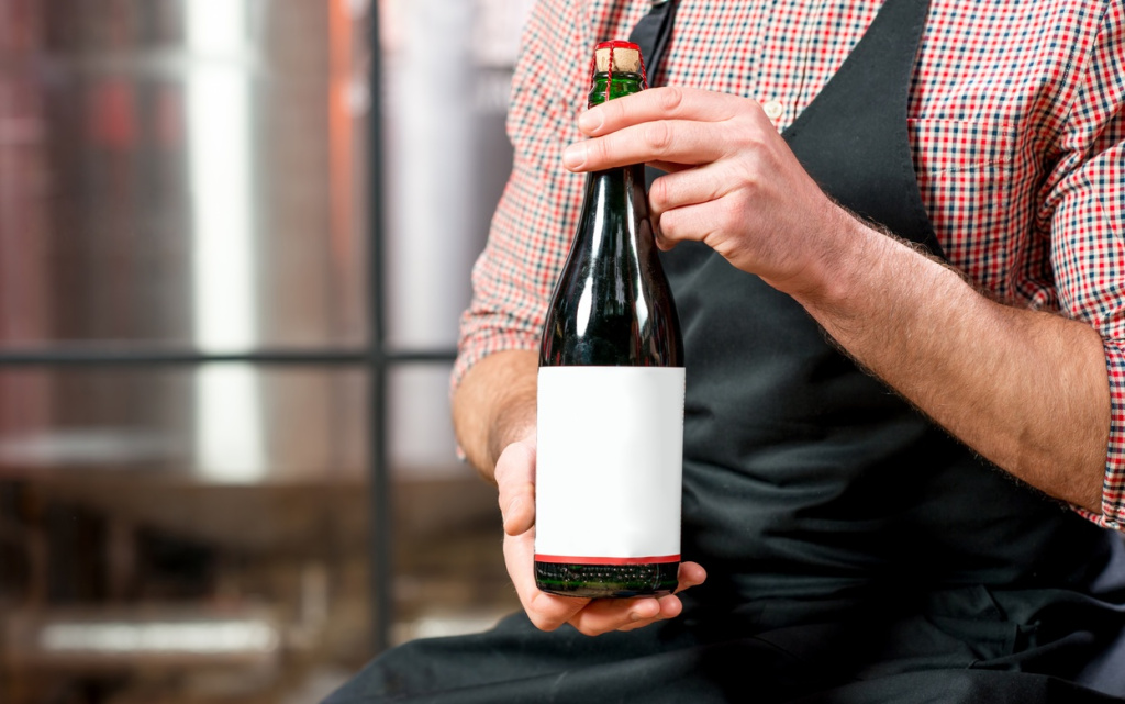 man-holds-beer-bottle-with-blank-label-2026-03-20-04-38-46-utc (1).jpg
