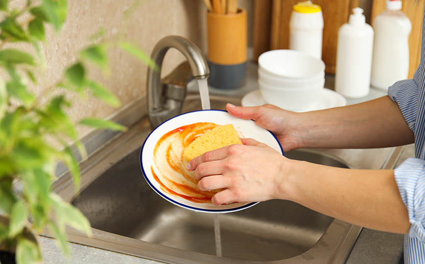 female-hands-wash-dishes-in-the-sink-2023-04-11-02-14-49-utc.jpg