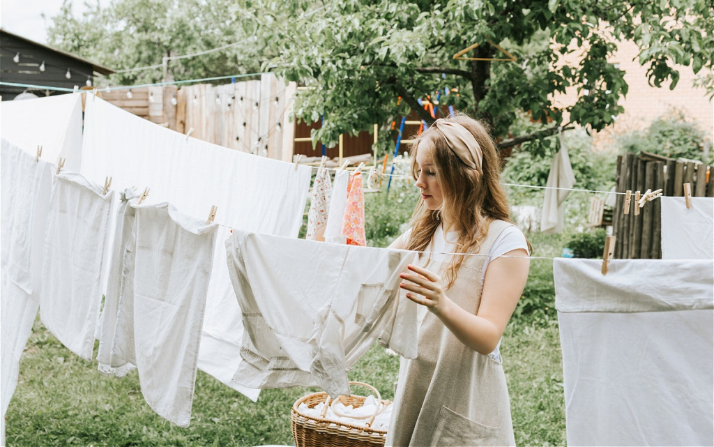 woman-hanging-white-laundry-outdoors-in-garden-2026-01-08-05-44-38-utc (1).jpg