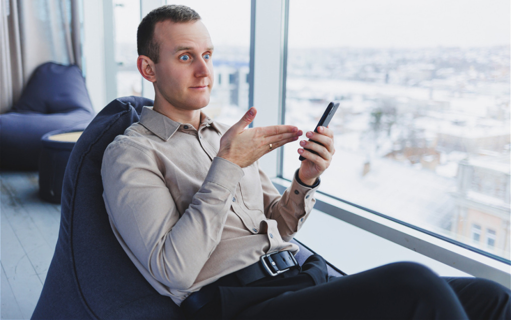 man-gesturing-while-looking-at-phone-indoors-2026-09-25-00-38-44-utc (1).jpg