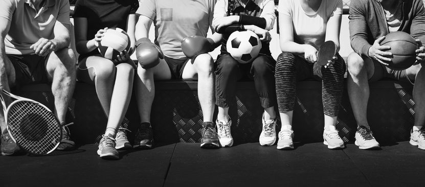 group-diverse-athletes-sitting-together.jpg