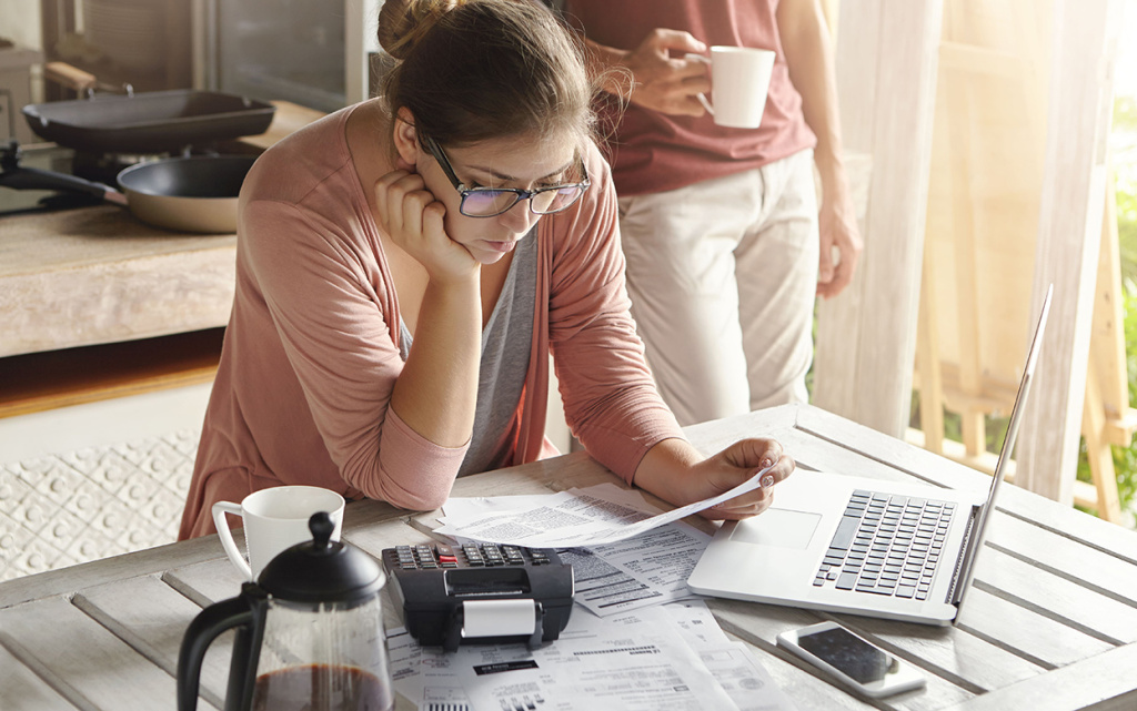 young-housewife-dressed-casually-focused-paperwork (1)_.jpg