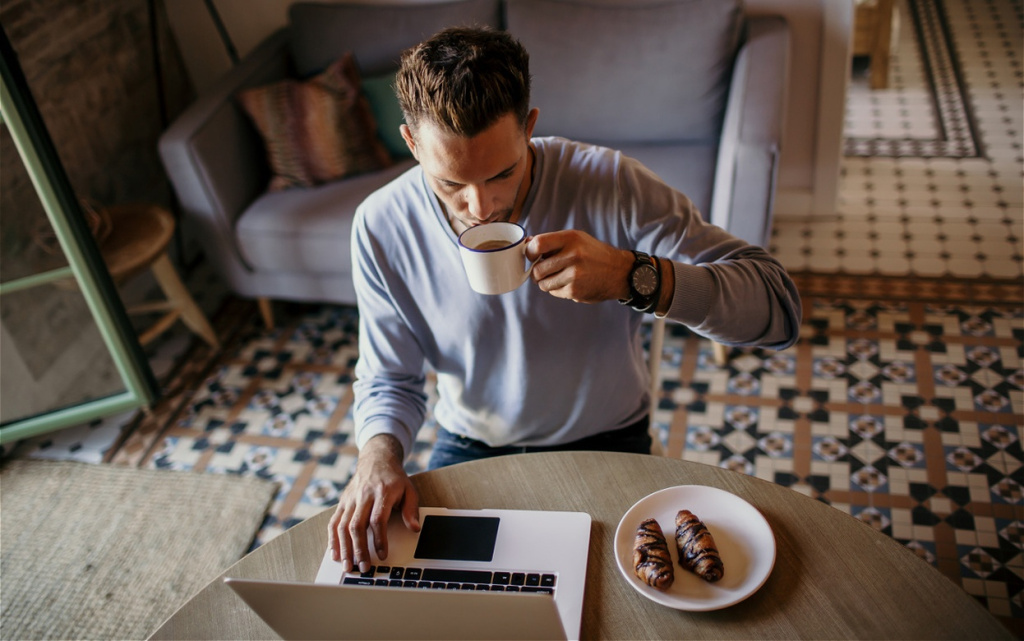 man-working-at-home-with-coffee-and-laptop-2026-01-05-01-02-29-utc (1).jpg