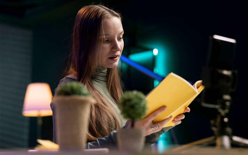 young-woman-reading-yellow-book-in-a-room-2026-03-19-02-05-13-utc (1).jpg