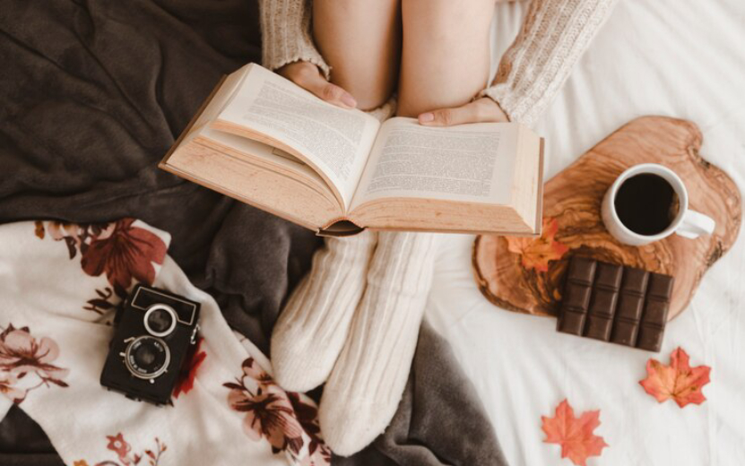 crop-woman-reading-near-camera-snack_23-2147888652.jpg