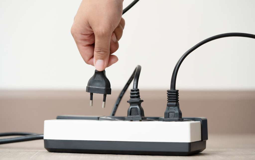 hand-connecting-a-black-ele.jpg
