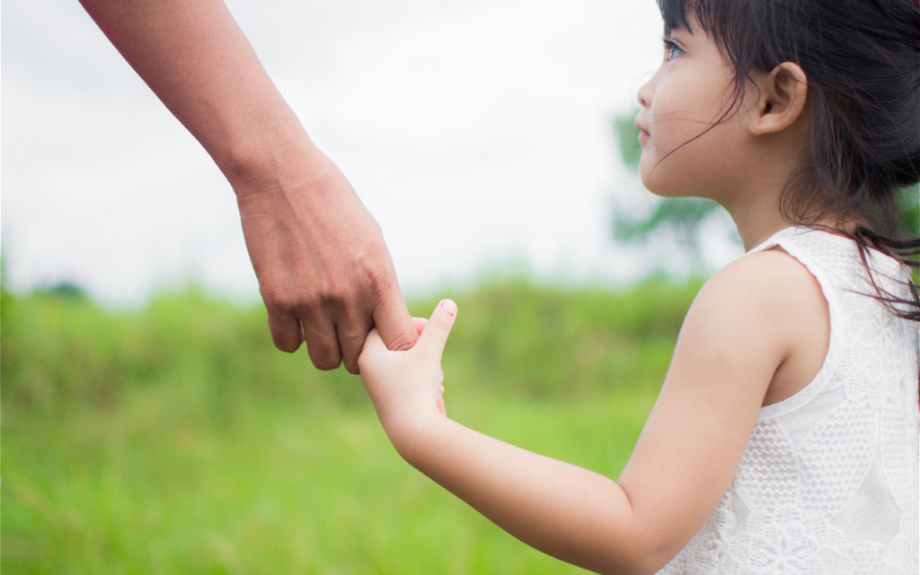 loving-parent-holds-little-girl-s-hand-outdoors-2026-03-09-22-08-49-utc (1).jpg