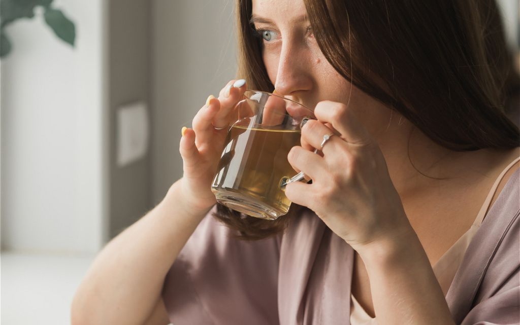 woman-relaxing-with-a-warm-drink-at-home-2026-09-22-01-56-54-utc (1).jpg