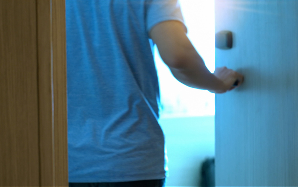 adult-opening-doorway-to-brightly-lit-room-2026-03-10-03-56-42-utc (1).jpg