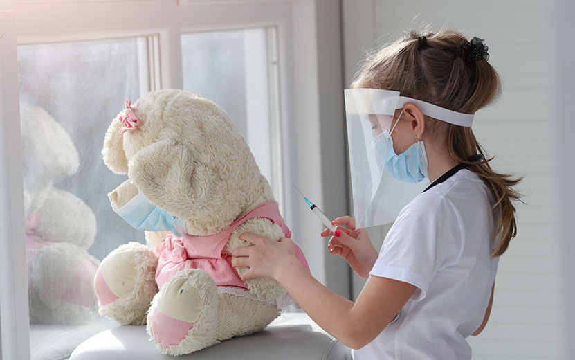 a-cute-little-girl-in-a-medical-mask-holds-a-syrin-2023-11-27-05-17-54-utc.jpg