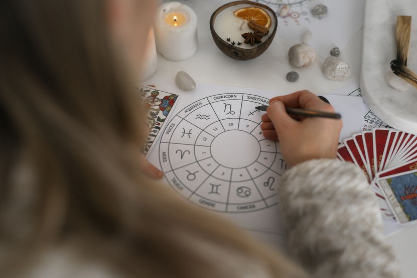 high-angle-woman-reading-tarot-home.jpg