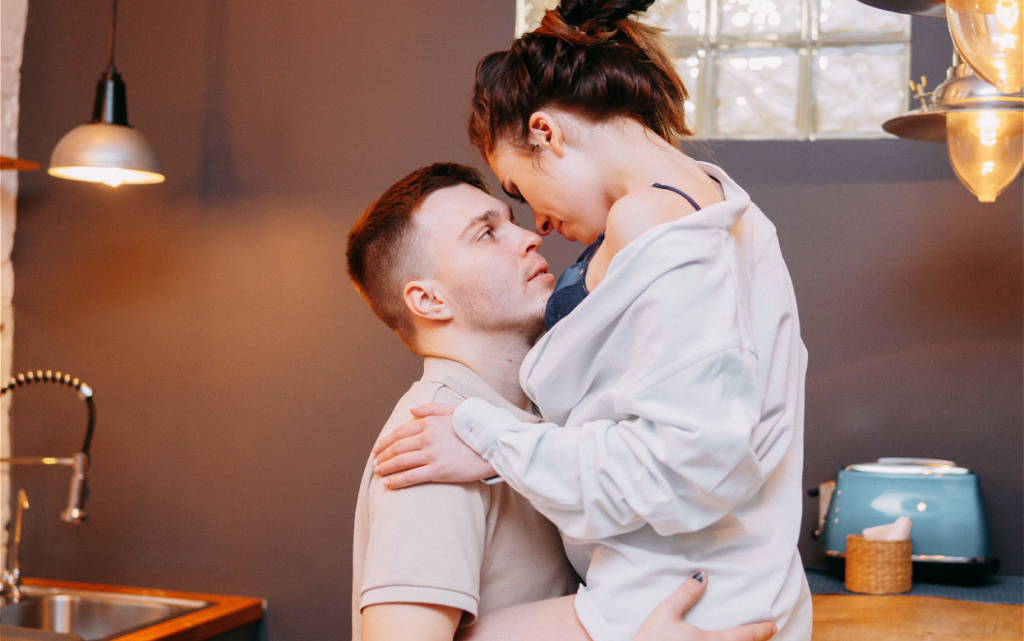 affectionate-couple-embracing-in-kitchen-at-home-2026-01-08-02-39-05-utc (1).jpg