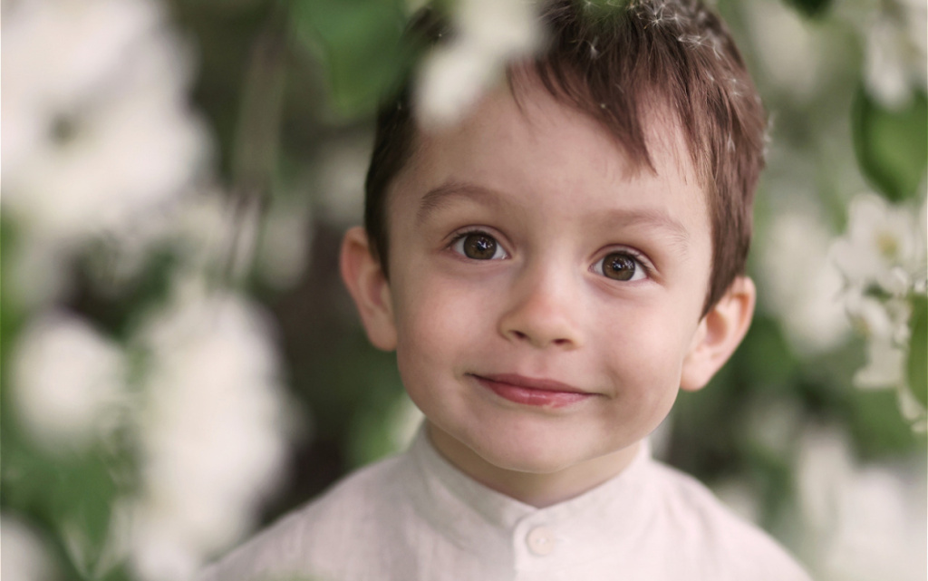 smiling-child-surrounded-by-white-blossoms-close-u-2026-03-09-23-50-21-utc (1).jpg